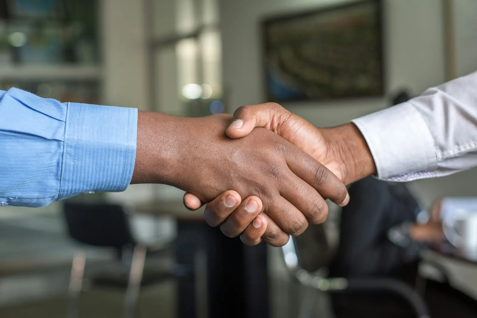 Business handshake representing trusted BlackShield Risk Management partnerships